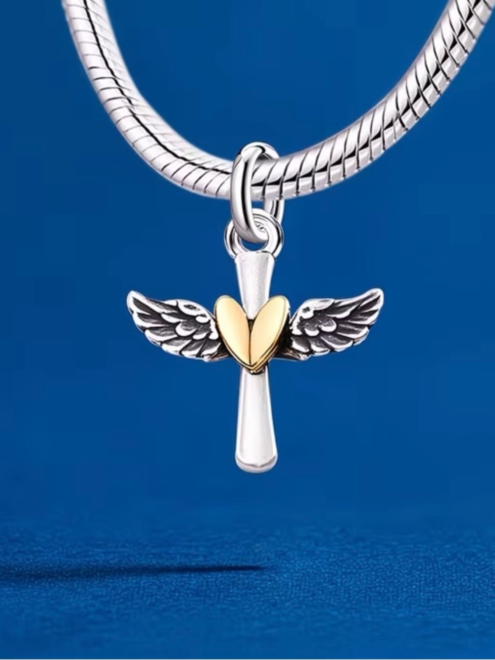 Silver Cross Pendant with Gold Heart and Wings charm